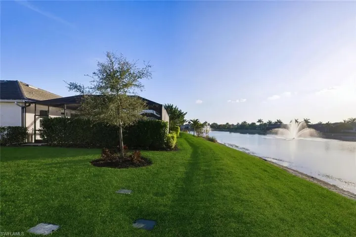 View of green lawn with a water view