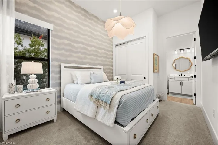 Carpeted bedroom with recessed lighting, a closet, and wallpapered walls