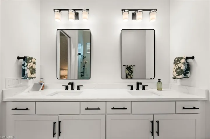 Bathroom featuring double vanity