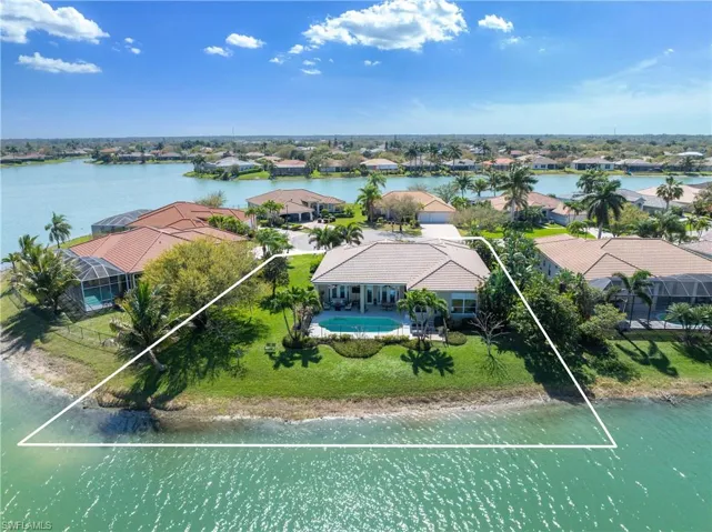 Drone / aerial view with a residential view and a water view