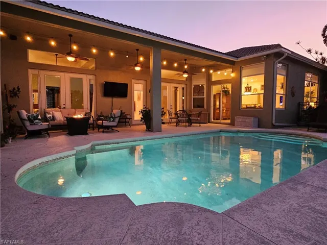 Outdoor pool featuring an outdoor hangout area, a patio area, and a ceiling fan