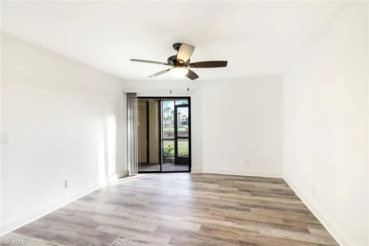 Spare room featuring light wood-style flooring and a ceiling fan