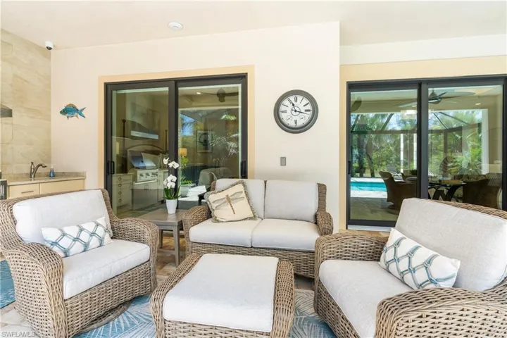 Living area featuring ceiling fan and a sunroom
