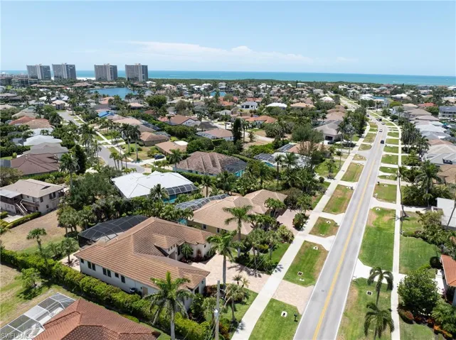 Aerial view with a water view and a residential view