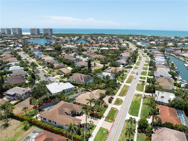 Bird's eye view with a residential view and a water view