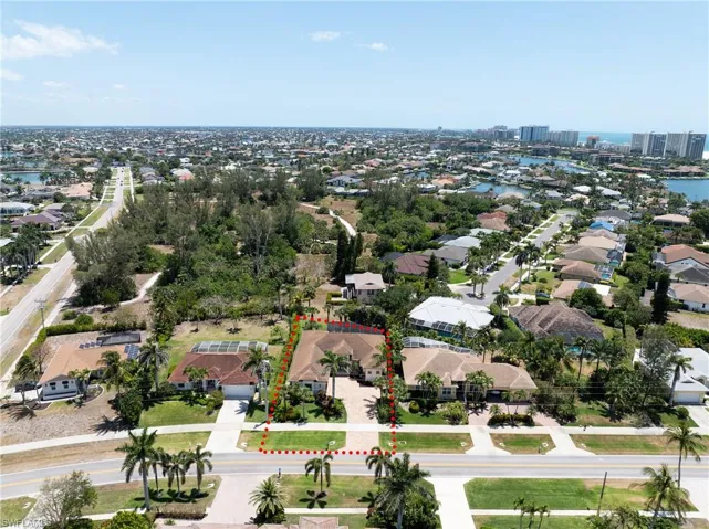 Birds eye view of property featuring a residential view and a water view