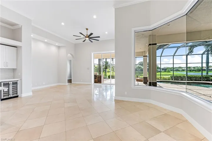 Light and bright breakfast area and family room with great views of the pool/spa and lake.
