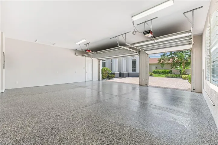 Garage featuring a garage door opener
