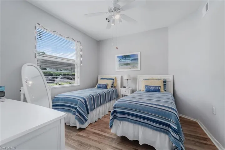 Bedroom featuring light wood-style floors and a ceiling fan