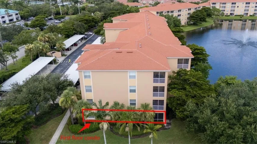 Bird's eye view of apartment complex and a nearby body of water