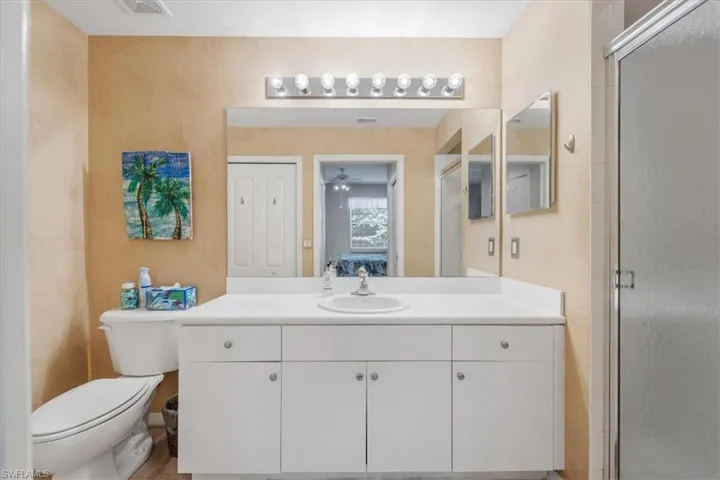 Ensuite bathroom with vanity and a shower stall