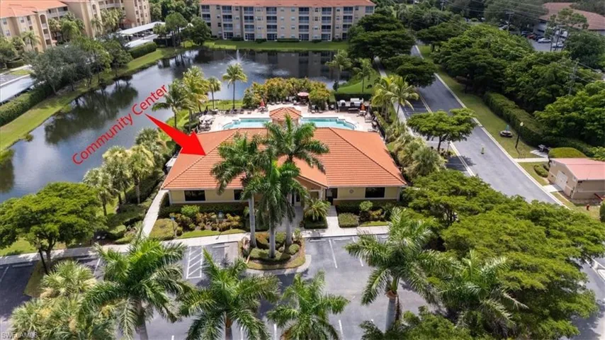 Drone / aerial view of a large body of water and apartment complex