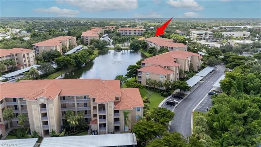 Bird's eye view of apartment complex and a large body of water