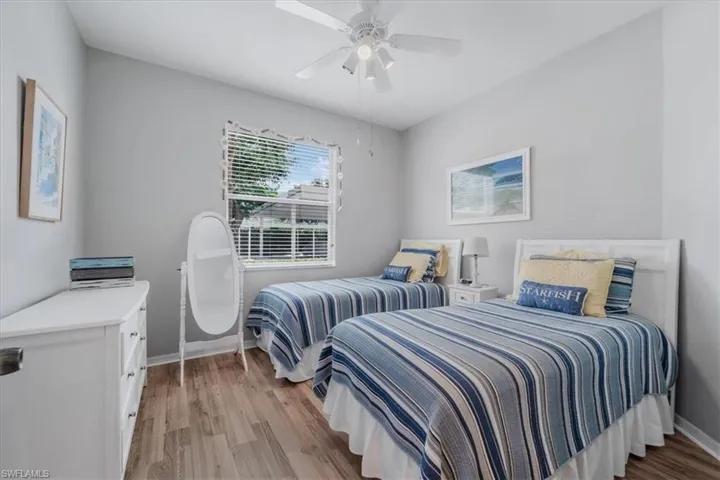 Bedroom featuring light wood-type flooring and a ceiling fan