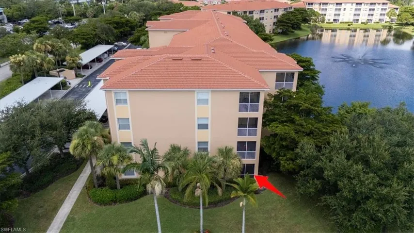 Bird's eye view of a large body of water and apartment complex / building