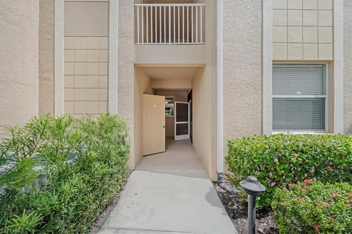 Property entrance with stucco siding
