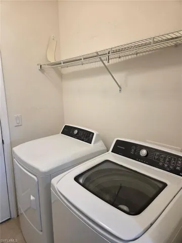 Washroom featuring separate washer and dryer