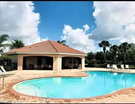 Community pool featuring a patio