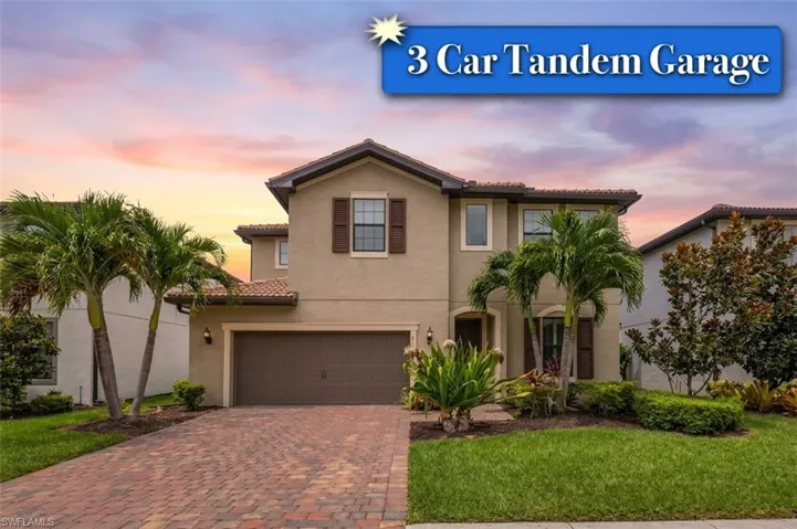Front exterior, Brick Paver Driveway, and 3 Car Attached Tandem Garage