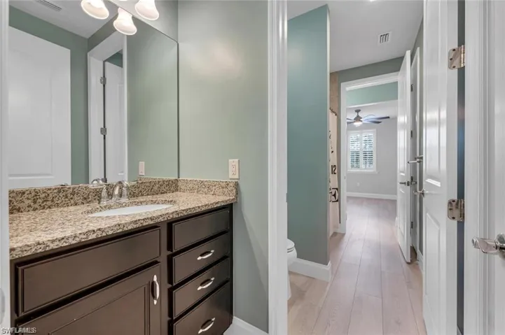 Bathroom featuring vanity and light wood-type flooring