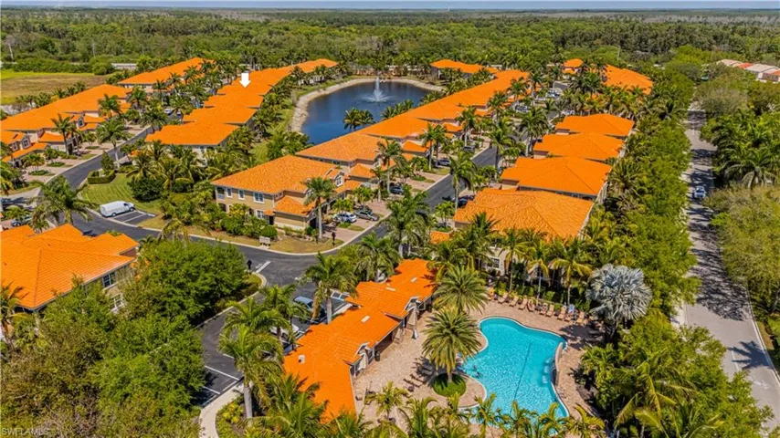 Bird's eye view with a forest view and a water view