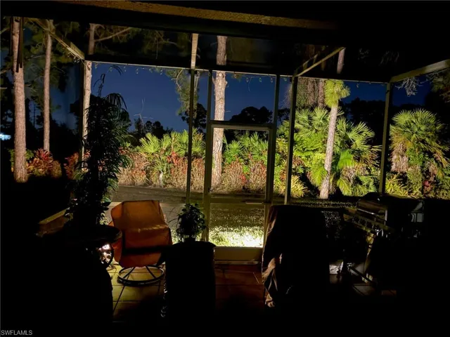 Evening view from lanai looking at landscaped yard