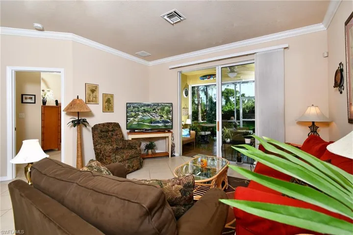Living room overlooking the extended screened lanai