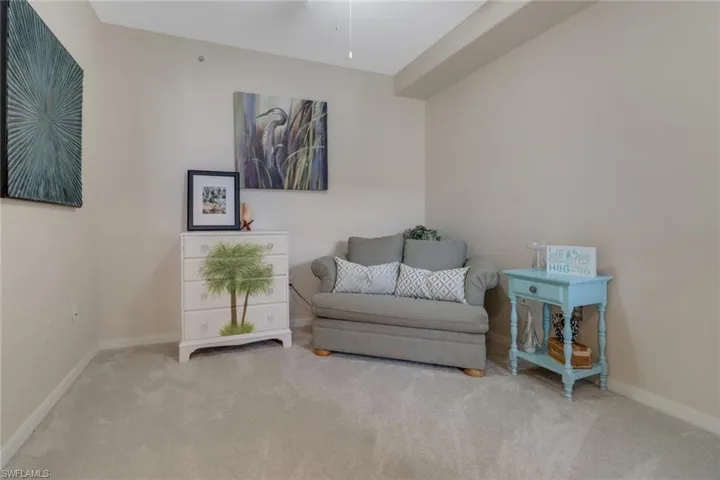 Sitting room with carpet flooring and ceiling fan