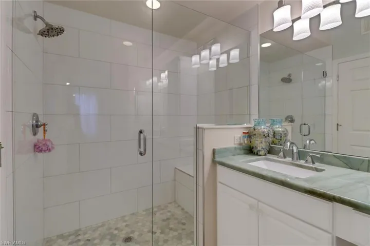 Full bath featuring vanity and a stall shower