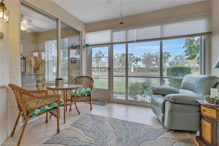 Sunroom / solarium with a water view
