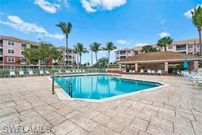 Community pool featuring a patio