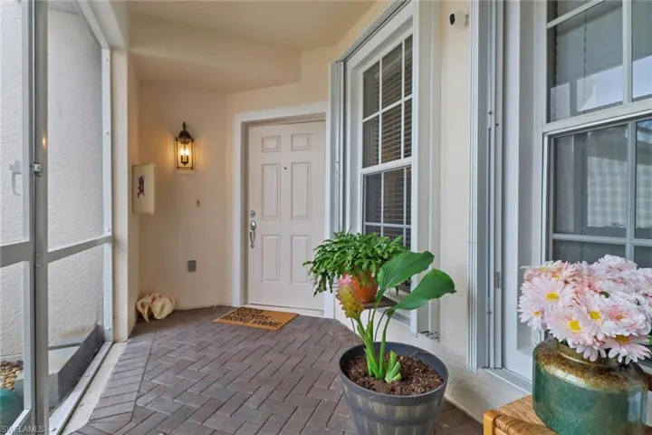 Entrance to property featuring stucco siding