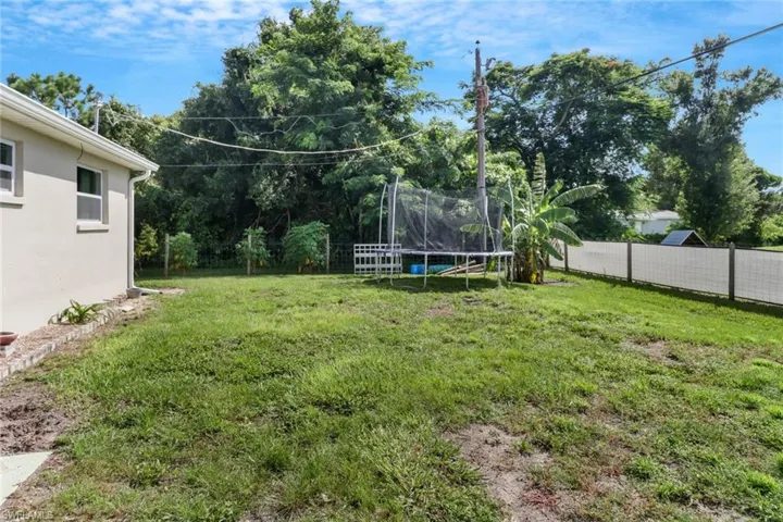 View of yard with a trampoline