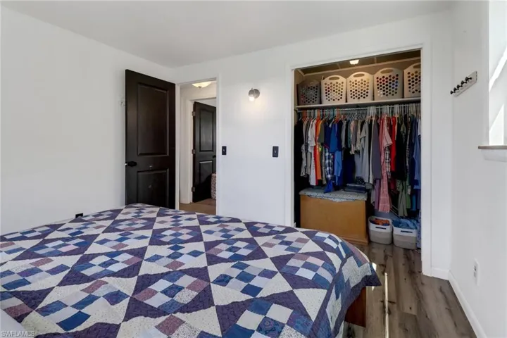 Bedroom featuring a closet and hardwood / wood-style flooring