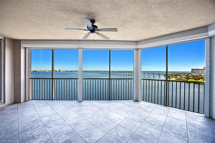 Unfurnished sunroom with a water view