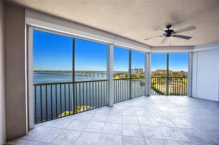 Unfurnished sunroom with a water view