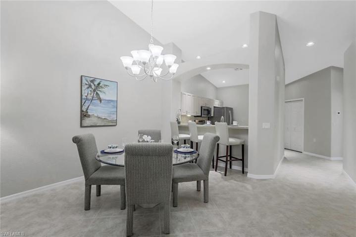 Dining room area with vaulted ceilings