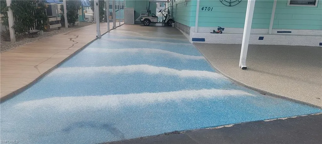 New Decorative Driveway depicts Beach Scene. The boardwalk on the left, ocean waves in center and beachy sand on the right. Awesome!