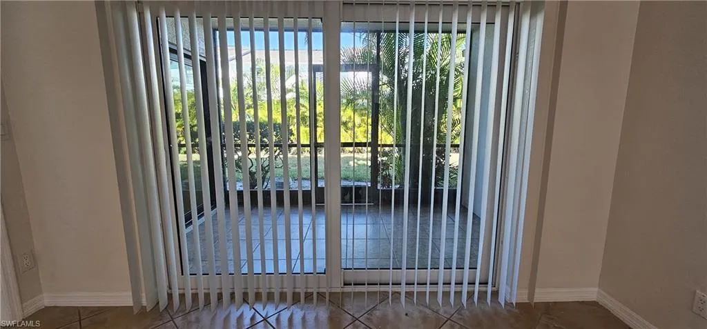 Doorway to outside featuring healthy amount of natural light