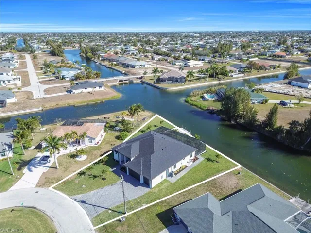 Aerial perspective of suburban area with a large body of water