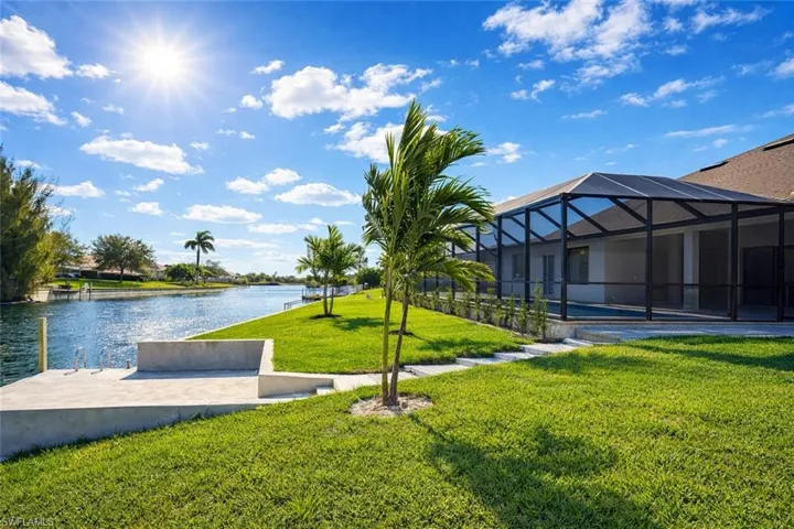 View of community with a sunroom and a water view