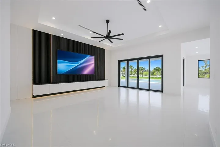 Unfurnished room with recessed lighting, ceiling fan, and light tile patterned flooring