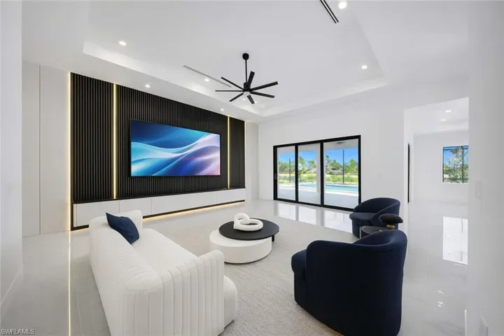 Home theater featuring ceiling fan and recessed lighting