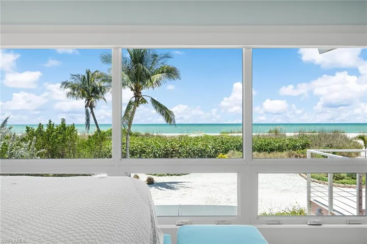 Primary suite featuring a peaceful beachfront setting.