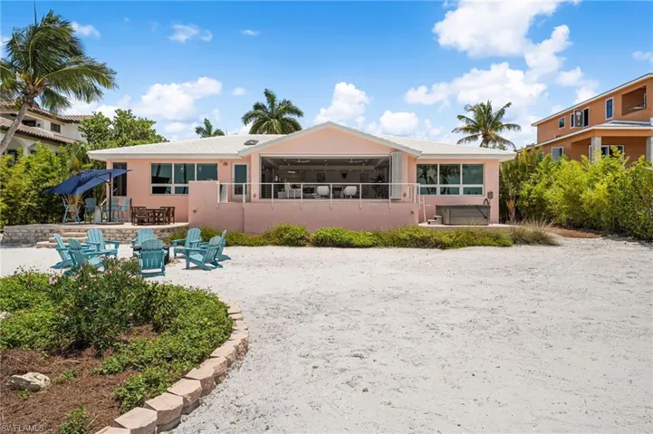 Tropical landscaping creates a private island oasis.