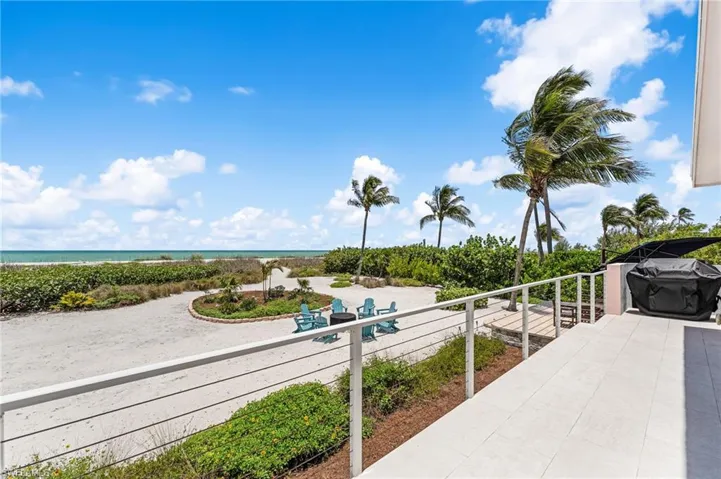 Seamless indoor-outdoor living with panoramic beach views.