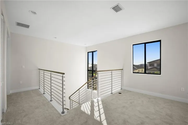 Primary bedroom with generous layout and natural light