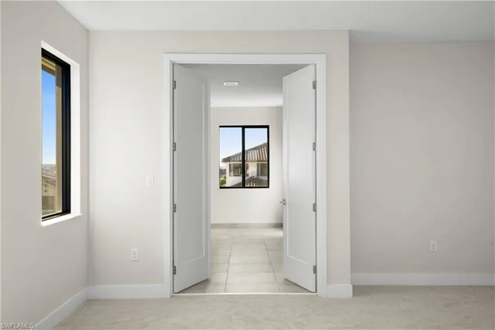 Primary bathroom with spa-style layout and refined finishes