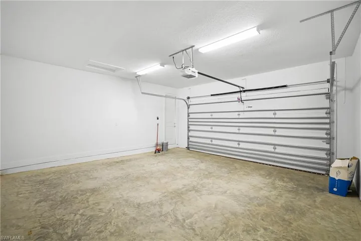Single-car garage bay completing the three-car garage layout