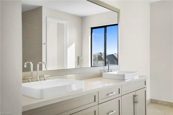 Oversized walk-in shower with floor-to-ceiling tile